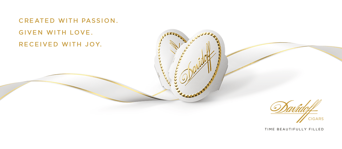 Davidoff White Band cigar rings placed in heart-shape on a white/golden ribbon