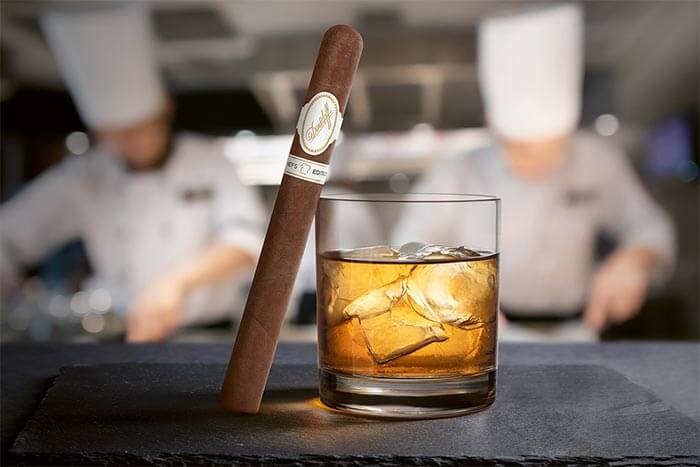 Davidoff Chefs Edition 2021 Churchill Cigar leaning on a glass of aged whisky