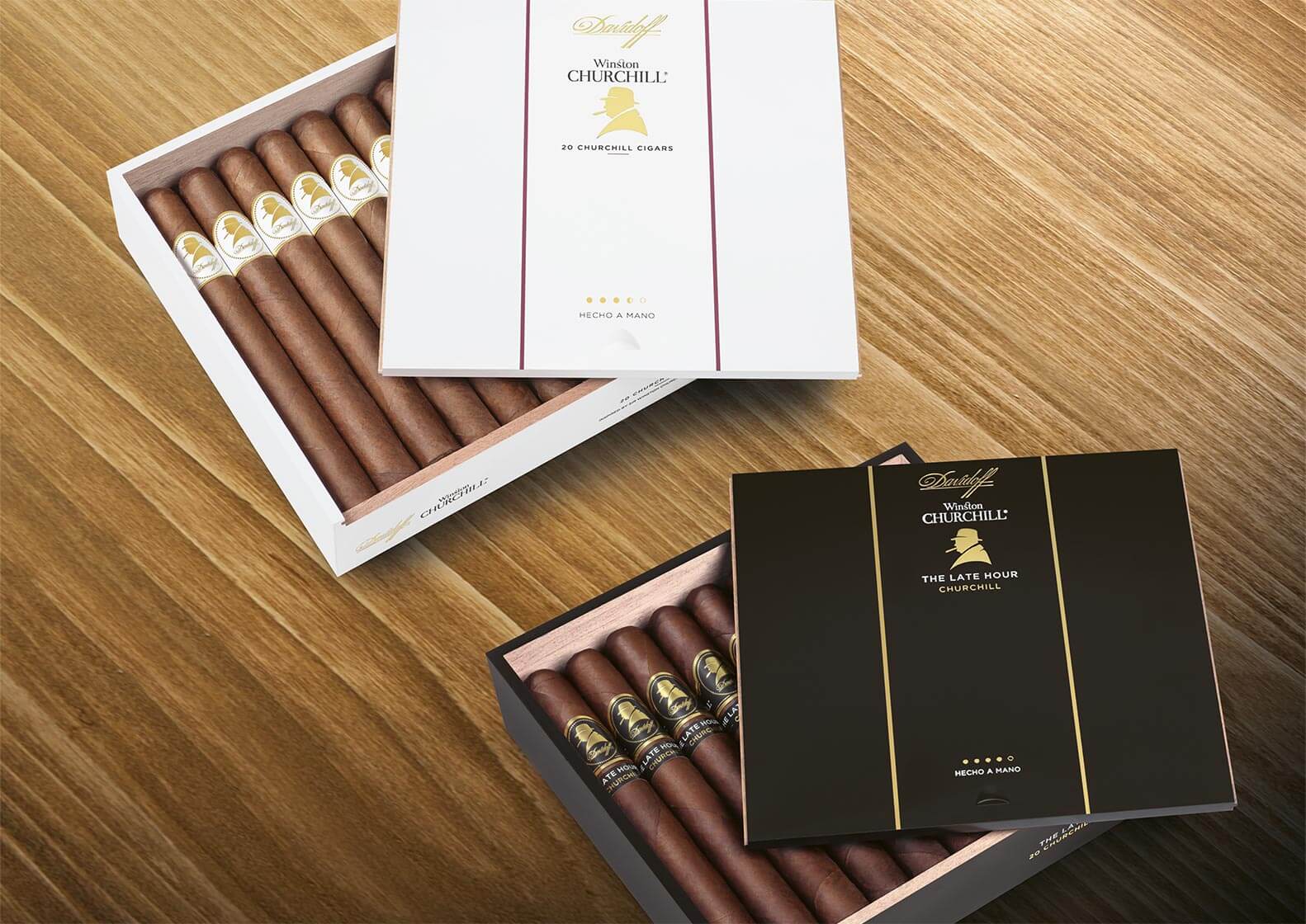 Open Davidoff Winston Churchill Original Collection and Late Hour Collection Cigar Boxes on a wooden underground
